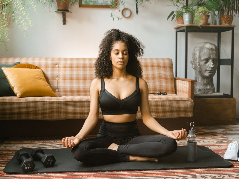 woman doing yoga in a black outfit